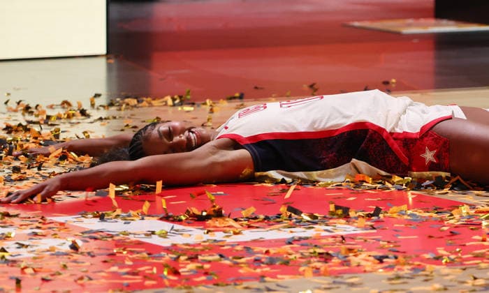 Angel Reese celebrates, lying in a sea of gold tinsel, as Team USA wins the World Championship. Joy, Emotion, Sports, Basketball, FIBA World Cup, Women s World Championship, World Championship, World Cup, Final, 2026-2027 Season, September 13, 2026, France vs. USA