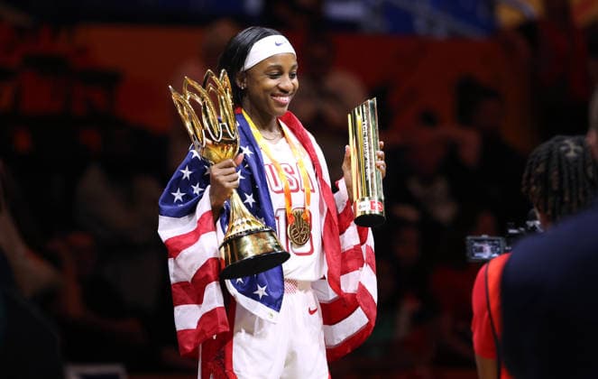Jackie Young poses with her gold medal and the World Cup trophy, celebrating Team USA s World Championship victory. Joy, Emotion, Sports, Basketball, FIBA World Cup, Women s World Championship, World Championship, World Cup Final, Season 2026–2027, September 13, 2026, France vs. USA