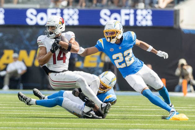 INGLEWOOD, CA - SEPTEMBER 13: Michael Wilson 14 of the Arizona Cardinals carries the ball while Genesis Smith 22 of the Los Angeles Chargers looks to complete the tackle during an NFL, American Football Herren, USA game between the Arizona Cardinals and the Los Angeles Chargers on September 13, 2026, at SoFi Stadium in Inglewood, California. (Photo by Greg Fiore Icon Sportswire) NFL: SEP 13 Cardinals at Chargers EDITORIAL USE ONLY Icon2609131655