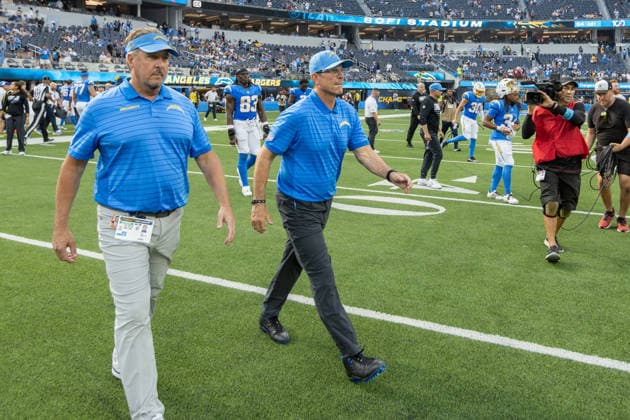 INGLEWOOD, CA - SEPTEMBER 13: Jim Harbaugh of the Los Angeles Chargers walks the 50 yard line to greet Arizona head coach Mike LaFleur following an NFL, American Football Herren, USA game between the Arizona Cardinals and the Los Angeles Chargers on September 13, 2026, at SoFi Stadium in Inglewood, California. (Photo by Greg Fiore Icon Sportswire) NFL: SEP 13 Cardinals at Chargers EDITORIAL USE ONLY Icon2609132425