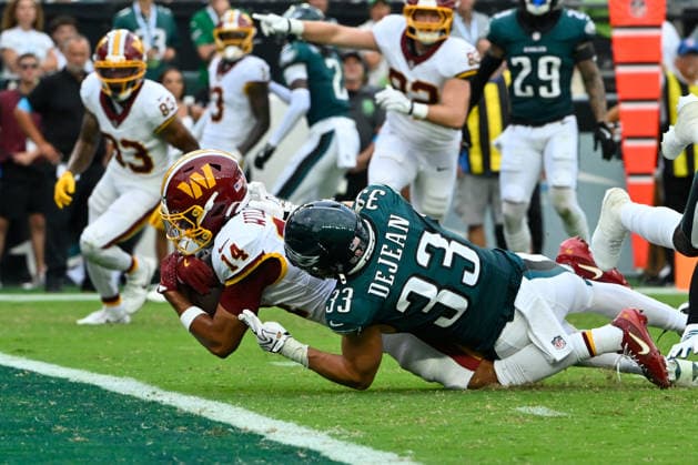 September 13, 2026; Philadelphia, Pennsylvania, USA; Philadelphia Eagles defensive back Cooper DeJean (33) tackles Washington Commanders wide receiver Antonio Williams (14) short of the goal line during the first half at Lincoln Financial Field. Mandatory Credit: -Cal Media NFL, American Football Herren, USA 2026: Commanders Vs Eagles SEP 13  - ZUMAc04_ 20260913_zma_c04_366 Copyright: xEricxCanhax