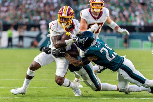 Washington Commanders running back Rachaad White (1) is tackled by Philadelphia Eagles safety Marcus Epps (29) in the fourth quarter of NFL, American Football Herren, USA action at Lincoln Financial Field in Philadelphia, Pennsylvania on Sunday, September 13, 2026.  PHI20260913018 LAURENCExKESTERSON