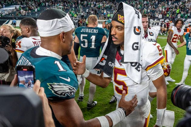 Washington Commanders quarterback Jayden Daniels (5) congratulates Philadelphia Eagles quarterback Jalen Hurts (1) at the conclusion of NFL, American Football Herren, USA action at Lincoln Financial Field in Philadelphia, Pennsylvania on Sunday, September 13, 2026.  PHI20260913024 LAURENCExKESTERSON