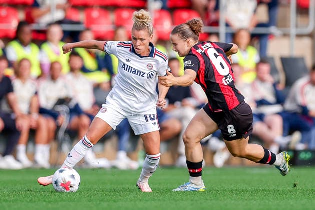 September 14, 2026, Soccer, Women s Bundesliga 1, Bayer 04 Leverkusen vs. FC Bayern Munich, Matchday 4, Ulrich Haberland Stadium, 2026–27 season: Linda Dallmann (FC Bayern Munich) 10 in a tackle against Paulina Platner (Bayer 04 Leverkusen) 06. DFB regulations prohibit any use of photographs as image sequences and or quasi-video. North Rhine-Westphalia, Germany
