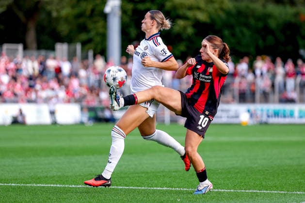September 14, 2026, Soccer, Women s Bundesliga 1, Bayer 04 Leverkusen vs. FC Bayern Munich, Matchday 4, Ulrich Haberland Stadium, 2026–27 Season: Klara Bühl (FC Bayern Munich) 17 in a tackle against Estrella Merino (Bayer 04 Leverkusen) 10. DFB regulations prohibit any use of photographs as image sequences and or quasi-video. North Rhine-Westphalia, Germany