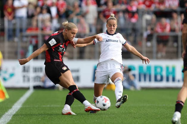 Cornelia Kramer of Bayer 04 Leverkusen and Giulia Gwinn of FC Bayern Munich battle for the ball during the Women s Bundesliga match between Bayer 04 Leverkusen and FC Bayern Munich at Ulrich Haberland Stadium on September 14, 2026, in Leverkusen, Germany. Photo by Oliver Kaelke, DeFodi Images. Cornelia Kramer of Bayer 04 Leverkusen and Giulia Gwinn of FC Bayern Munich battle for the ball during the Bundesliga match between Bayer 04 Leverkusen and FC Bayern Munich at Ulrich Haberland Stadium on September 14, 2026 in Leverkusen, Germany Photo by Oliver Kaelke, DeFodi Images DFB and DFL regulations prohibit any use of photographs as image sequences and or quasi-video Photo by Oliver Kaelke, DeFodi Images