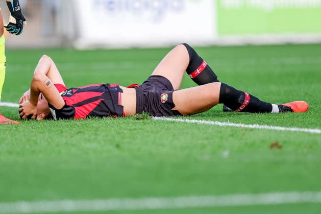 September 14, 2026, Soccer, Women s Bundesliga 1, Bayer 04 Leverkusen vs. FC Bayern Munich, Matchday 4, Ulrich Haberland Stadium, 2026–27 Season Selina Ostermeier of Bayer 04 Leverkusen 02 is injured on the field and requires medical attention; she is injured due to dizziness; injury on the field. DFB regulations prohibit any use of photographs as image sequences and or quasi-video. North Rhine-Westphalia, Germany