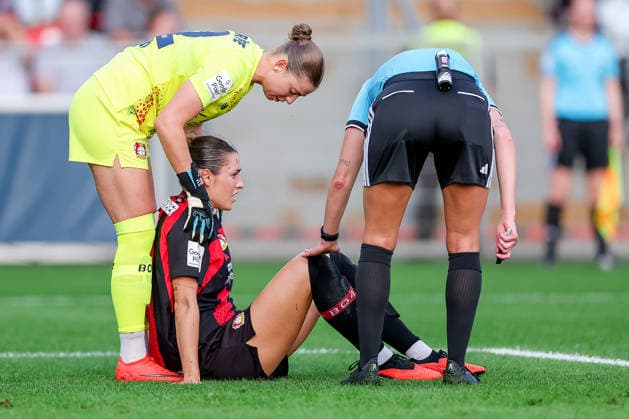 September 14, 2026, Soccer, Women s Bundesliga 1, Bayer 04 Leverkusen vs. FC Bayern Munich, Matchday 4, Ulrich Haberland Stadium, 2026–27 Season Selina Ostermeier of Bayer 04 Leverkusen 02 is injured on the field and requires medical attention; she is injured due to dizziness; injury on the field. DFB regulations prohibit any use of photographs as image sequences and or quasi-video. North Rhine-Westphalia, Germany