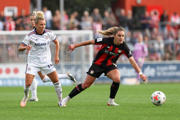 Linda Dallmann of FC Bayern Munich and Paulina Tomasiak of Bayer 04 Leverkusen battle for the ball during the Women s Bundesliga match between Bayer 04 Leverkusen and FC Bayern Munich at Ulrich Haberland Stadium on September 14, 2026, in Leverkusen, Germany. Photo by Oliver Kaelke, DeFodi Images. Linda Dallmann of FC Bayern Munich and Paulina Tomasiak of Bayer 04 Leverkusen battle for the ball during the Bundesliga match between Bayer 04 Leverkusen and FC Bayern Munich at Ulrich Haberland Stadium on September 14, 2026 in Leverkusen, Germany. Photo by Oliver Kaelke, DeFodi Images. DFB and DFL regulations prohibit any use of photographs as image sequences and or quasi-video. Photo by Oliver Kaelke, DeFodi Images.