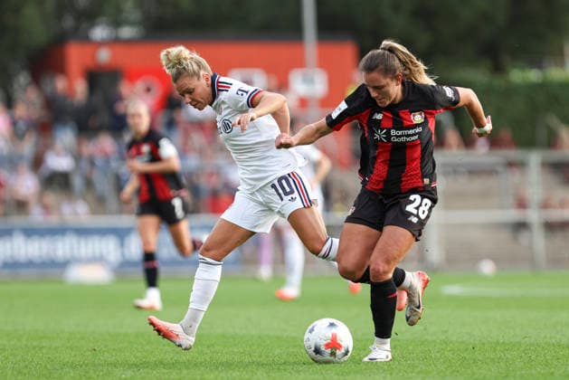 Linda Dallmann of FC Bayern Munich and Paulina Tomasiak of Bayer 04 Leverkusen battle for the ball during the Women s Bundesliga match between Bayer 04 Leverkusen and FC Bayern Munich at Ulrich Haberland Stadium on September 14, 2026, in Leverkusen, Germany. Photo by Oliver Kaelke, DeFodi Images. Linda Dallmann of FC Bayern Munich and Paulina Tomasiak of Bayer 04 Leverkusen battle for the ball during the Bundesliga match between Bayer 04 Leverkusen and FC Bayern Munich at Ulrich Haberland Stadium on September 14, 2026 in Leverkusen, Germany. Photo by Oliver Kaelke, DeFodi Images. DFB and DFL regulations prohibit any use of photographs as image sequences and or quasi-video. Photo by Oliver Kaelke, DeFodi Images.