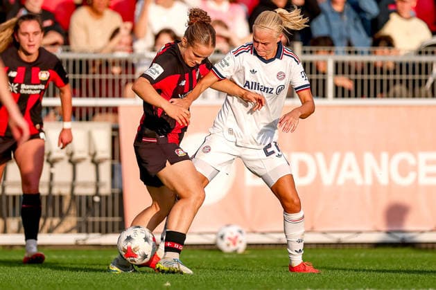September 14, 2026, Soccer, Women s Bundesliga 1, Bayer 04 Leverkusen vs. FC Bayern Munich, Matchday 4, Ulrich Haberland Stadium, 2026–27 season: Paulina Platner of Bayer 04 Leverkusen (No. 06) in a tackle against Pernille Harder of FC Bayern Munich (No. 21). DFB regulations prohibit any use of photographs as image sequences and or quasi-video. North Rhine-Westphalia, Germany