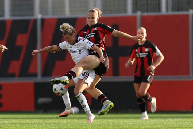Linda Dallmann of FC Bayern Munich and Paulina Platner of Bayer 04 Leverkusen battle for the ball during the Women s Bundesliga match between Bayer 04 Leverkusen and FC Bayern Munich at Ulrich Haberland Stadium on September 14, 2026, in Leverkusen, Germany. Photo by Oliver Kaelke, DeFodi Images. Linda Dallmann of FC Bayern Munich and Paulina Platner of Bayer 04 Leverkusen battle for the ball during the Bundesliga match between Bayer 04 Leverkusen and FC Bayern Munich at Ulrich Haberland Stadium on September 14, 2026 in Leverkusen, Germany. Photo by Oliver Kaelke, DeFodi Images. DFB and DFL regulations prohibit any use of photographs as image sequences and or quasi-video. Photo by Oliver Kaelke, DeFodi Images.