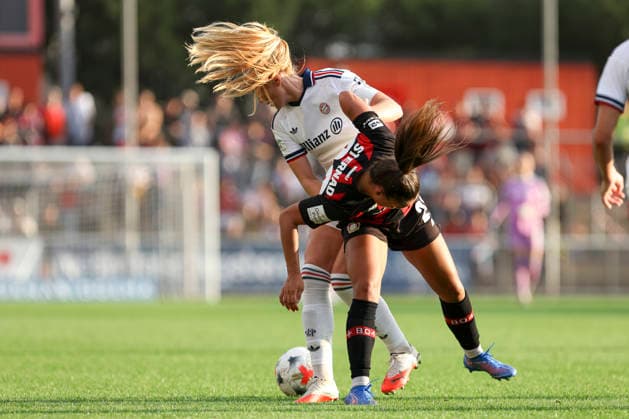 Glodis Perla Viggosdottir of FC Bayern Munich and Maja Sternad of Bayer 04 Leverkusen go head-to-head during the Women s Bundesliga match between Bayer 04 Leverkusen and FC Bayern Munich, at Ulrich Haberland Stadium on September 14, 2026, in Leverkusen, Germany. Photo by Oliver Kaelke, DeFodi Images. Glodis Perla Viggosdottir of FC Bayern Munich and Maja Sternad of Bayer 04 Leverkusen battle for the ball during the Bundesliga match between Bayer 04 Leverkusen and FC Bayern Munich at Ulrich Haberland Stadium on September 14, 2026 in Leverkusen, Germany. Photo by Oliver Kaelke, DeFodi Images. DFB and DFL regulations prohibit any use of photographs as image sequences and or quasi-video. Photo by Oliver Kaelke, DeFodi Images.