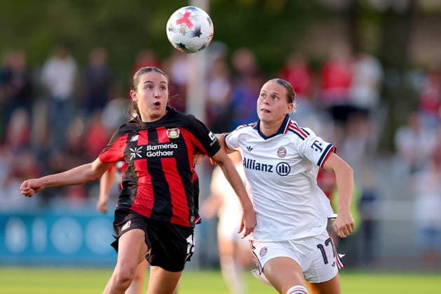September 14, 2026, Soccer, Women s Bundesliga 1, Bayer 04 Leverkusen vs. FC Bayern Munich, Matchday 4, Ulrich Haberland Stadium, 2026–27 season: Loreen Bender (Bayer 04 Leverkusen, No. 19) in a tackle against Klara Bühl (FC Bayern Munich, No. 17). DFB regulations prohibit any use of photographs as image sequences and or quasi-video. North Rhine-Westphalia, Germany