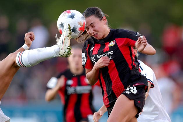 September 14, 2026, Soccer, Women s Bundesliga 1, Bayer 04 Leverkusen vs. FC Bayern Munich, Matchday 4, Ulrich Haberland Stadium, 2026–27 Season: Loreen Bender of Bayer 04 Leverkusen (No. 19) in a tackle against Jovana Damnjanovic of FC Bayern Munich (No. 09). DFB regulations prohibit any use of photographs as image sequences and or quasi-video. North Rhine-Westphalia, Germany