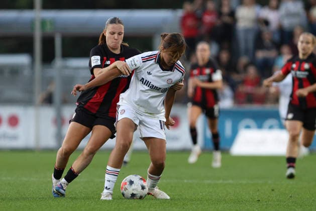 Estrella Merino Gonzalez of Bayer 04 Leverkusen and Momoko Tanikawa of FC Bayern Munich battle for the ball during the Women s Bundesliga match between Bayer 04 Leverkusen and FC Bayern Munich at Ulrich Haberland Stadium on September 14, 2026, in Leverkusen, Germany. Photo by Oliver Kaelke, DeFodi Images. Estrella Merino Gonzalez of Bayer 04 Leverkusen and Momoko Tanikawa of FC Bayern Munich battle for the ball during the Bundesliga match between Bayer 04 Leverkusen and FC Bayern Munich at Ulrich Haberland Stadium on September 14, 2026 in Leverkusen, Germany. Photo by Oliver Kaelke, DeFodi Images. DFB and DFL regulations prohibit any use of photographs as image sequences and or quasi-video. Photo by Oliver Kaelke, DeFodi Images.