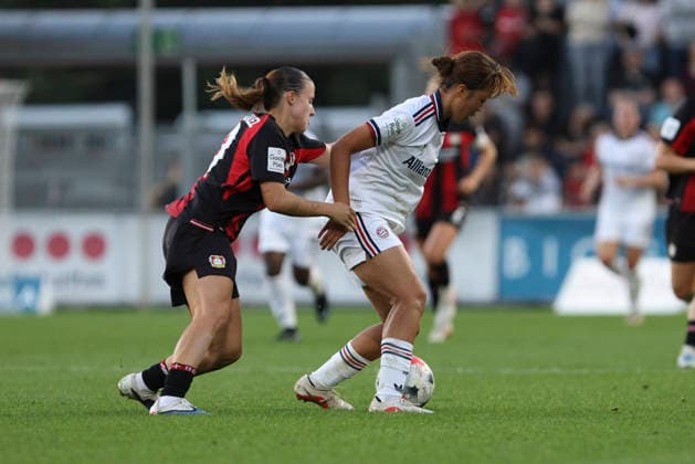 Estrella Merino Gonzalez of Bayer 04 Leverkusen and Momoko Tanikawa of FC Bayern Munich battle for the ball during the Women s Bundesliga match between Bayer 04 Leverkusen and FC Bayern Munich at Ulrich Haberland Stadium on September 14, 2026, in Leverkusen, Germany. Photo by Oliver Kaelke, DeFodi Images. Estrella Merino Gonzalez of Bayer 04 Leverkusen and Momoko Tanikawa of FC Bayern Munich battle for the ball during the Bundesliga match between Bayer 04 Leverkusen and FC Bayern Munich at Ulrich Haberland Stadium on September 14, 2026 in Leverkusen, Germany. Photo by Oliver Kaelke, DeFodi Images. DFB and DFL regulations prohibit any use of photographs as image sequences and or quasi-video. Photo by Oliver Kaelke, DeFodi Images.