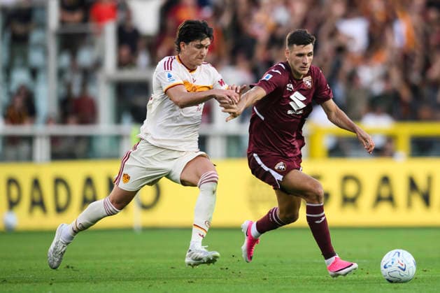 Torino FC v AS Roma - Serie A Gvidas Gineitis of Torino FC competes for the ball with Leonardo Balerdi of AS Roma during the Serie A football match between Torino FC and AS Roma. Turin Italy Copyright: xNicolòxCampox