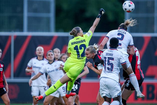 September 14, 2026, Soccer, Women s Bundesliga 1, Bayer 04 Leverkusen vs. FC Bayern Munich, Matchday 4, Ulrich Haberland Stadium, 2026–27 Season: Rafaela Borggräfe (Bayer 04 Leverkusen) 12 defends against Bernadette Amani (FC Bayern Munich) in the penalty area; Vanessa Gilles (FC Bayern Munich) 02 penalty area play. DFB regulations prohibit any use of photographs as image sequences and or quasi-video. North Rhine-Westphalia, Germany