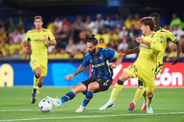 Isco Alarcon of Real Betis and Carlos Romero of Villarreal CF during the LaLiga EA Sports match between Villarreal CF and Real Betis Balompie at Estadio de la Cerámica on September 14, 2026, in Villarreal, Spain