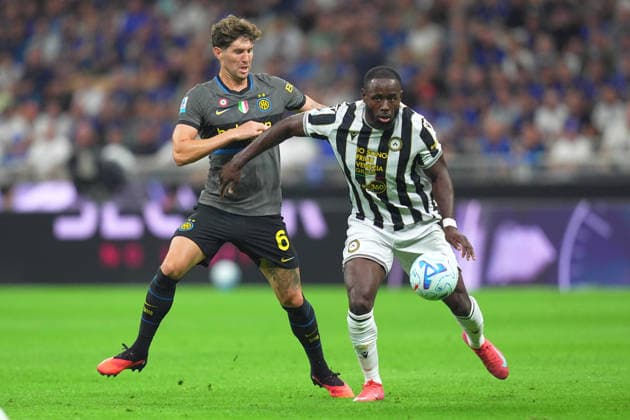 Inter Milan™s John Stones fights for the ball with Udinese s Keinan Davis during the Serie A soccer match between Fc Inter and Udinese the San Siro Stadium in Milan, north Italy - September 14 , 2026. - Soccer  Copyright: xSpada LaPressex