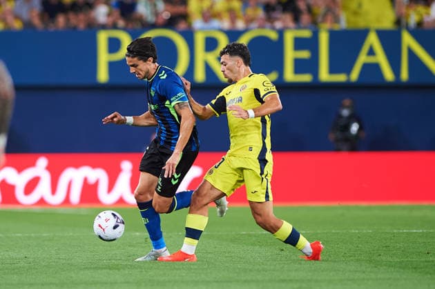 Marc Bartra of Real Betis and Georges Mikautadze of Villarreal CF during the LaLiga EA Sports match between Villarreal CF and Real Betis Balompie at Estadio de la Cerámica on September 14, 2026, in Villarreal, Spain