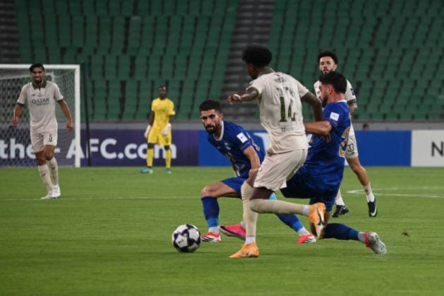 AFC Champions League - Esteghlal v Al Sadd BASRA, IRAQ - SEPTEMBER 14: Yousuf Abdurisag (12) of Qatar s Al Sadd SC vies for the ball against opponents during the AFC Champions League Elite match between Iran s Esteghlal FC and Qatar s Al Sadd SC at the Basra Sports Complex in Basra, Iraq, on September 14, 2026. Haidar Mohammed Ali Anadolu Basra Iraq. Editorial use only. Please get in touch for any other usage.  Copyright: x2026xAnadoluxHaidarxMohammedxAlix