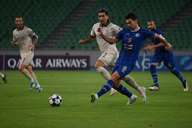 AFC Champions League - Esteghlal v Al Sadd BASRA, IRAQ - SEPTEMBER 14: Rustam Ashurmatov (5) of Iran s Esteghlal FC vies for the ball against an opponent during the AFC Champions League Elite match between Iran s Esteghlal FC and Qatar s Al Sadd SC at the Basra Sports Complex in Basra, Iraq, on September 14, 2026. Haidar Mohammed Ali Anadolu Basra Iraq. Editorial use only. Please get in touch for any other usage.  Copyright: x2026xAnadoluxHaidarxMohammedxAlix