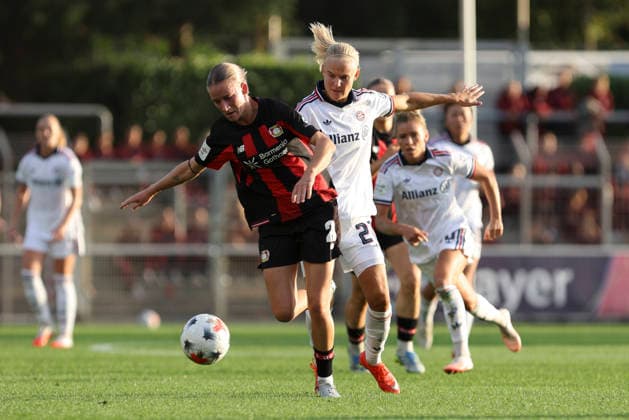 Marlene Mueller of Bayer 04 Leverkusen and Pernille Harder of FC Bayern Munich battle for the ball during the Women s Bundesliga match between Bayer 04 Leverkusen and FC Bayern Munich at Ulrich Haberland Stadium on September 14, 2026, in Leverkusen, Germany Photo by Oliver Kaelke, DeFodi Images Marlene Mueller of Bayer 04 Leverkusen and Pernille Harder of FC Bayern Munich battle for the ball during the Bundesliga match between Bayer 04 Leverkusen and FC Bayern Munich at Ulrich Haberland Stadium on September 14, 2026 in Leverkusen, Germany. Photo by Oliver Kaelke, DeFodi Images. DFB and DFL regulations prohibit any use of photographs as image sequences and or quasi-video. Photo by Oliver Kaelke, DeFodi Images.