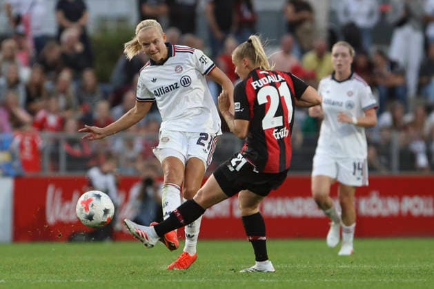 Pernille Harder of FC Bayern Munich and Vanessa Fudalla of Bayer 04 Leverkusen battle for the ball during the Women s Bundesliga match between Bayer 04 Leverkusen and FC Bayern Munich at Ulrich Haberland Stadium on September 14, 2026, in Leverkusen, Germany. Photo by Oliver Kaelke, DeFodi Images. Pernille Harder of FC Bayern Munich and Vanessa Fudalla of Bayer 04 Leverkusen battle for the ball during the Bundesliga match between Bayer 04 Leverkusen and FC Bayern Munich at Ulrich Haberland Stadium on September 14, 2026 in Leverkusen, Germany. Photo by Oliver Kaelke, DeFodi Images. DFB and DFL regulations prohibit any use of photographs as image sequences and or quasi-video. Photo by Oliver Kaelke, DeFodi Images.