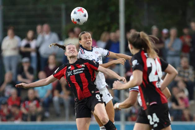 Claudia Wenger of Bayer 04 Leverkusen and Klara Buehl of FC Bayern Munich battle for the ball during the Women s Bundesliga match between Bayer 04 Leverkusen and FC Bayern Munich at Ulrich Haberland Stadium on September 14, 2026, in Leverkusen, Germany. Photo by Oliver Kaelke, DeFodi Images. Claudia Wenger of Bayer 04 Leverkusen and Klara Buehl of FC Bayern Munich battle for the ball during the Bundesliga match between Bayer 04 Leverkusen and FC Bayern Munich at Ulrich Haberland Stadium on September 14, 2026 in Leverkusen, Germany. Photo by Oliver Kaelke, DeFodi Images. DFB and DFL regulations prohibit any use of photographs as image sequences and or quasi-video. Photo by Oliver Kaelke, DeFodi Images.