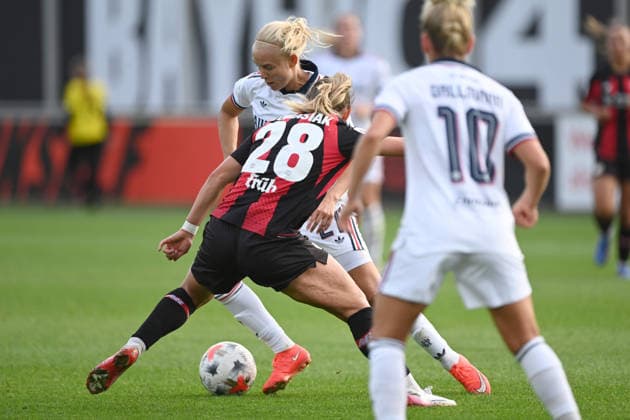 Pernille HARDER (M) vs. Paulina TOMASIAK (LEV), with Linda DALLMANN (M) in the foreground; Bayer 04 Leverkusen vs. FC Bayern Munich 2–3; Soccer; Google Pixel; Women s Bundesliga, 2026–2027 season, Matchday 4, on September 14, 2026, at the Ulrich Habeland Stadium in Leverkusen, Â