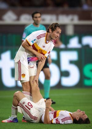 Torino FC v AS Roma - Serie A - Season 2026-2027 Turin, Italy, 14th September 2026. Marten De Roon of AS Roma assists team mate Niccolo Pisilli after he pulled up with cramp whilst celebrating his goal that gave the visitors a 2-0 lead the Torino FC vs AS Roma Serie A match at Stadio Grande Torino, Turin. Picture credit should read: Jonathan Moscrop Turin Stadio Olimpico Grande Torino Italy