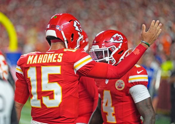 Kansas City Chiefs quarterback Patrick Mahomes (15) congratulates Kansas City Chiefs wide receiver Rashee Rice (4) after a score against the Broncos on Monday Night Football at Arrowhead Stadium in Kansas City, Missouri on Monday September 14, 2026.  KCP2026091419 JONxROBICHAUD