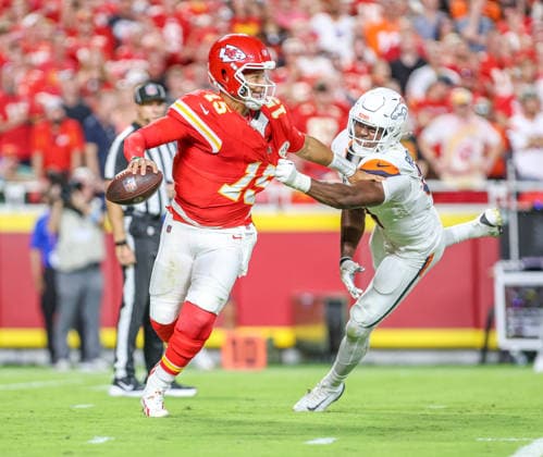 Sep 14, 2026: Kansas City Chiefs quarterback Patrick MahomesÃ‚ (15) tries to get away from Denver Broncos outside linebacker Que Robinson (51) in Kansas City, MO, USA; at Arrowhead Stadium. Mandatory Credit: -Cal Media Kansas City USA - ZUMAc04_ 20260914_zma_c04_054 Copyright: xRomanxPunox