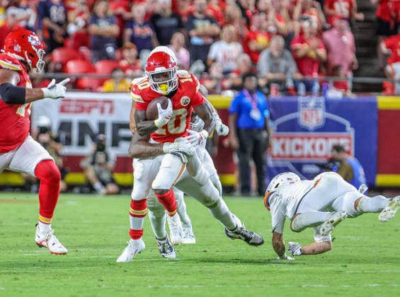 Sep 14, 2026: Kansas City Chiefs running back Emmett Johnson (10) gets tackled during a run against the Denver Broncos in Kansas City, MO, USA; at Arrowhead Stadium. Mandatory Credit: -Cal Media Kansas City USA - ZUMAc04_ 20260914_zma_c04_071 Copyright: xRomanxPunox