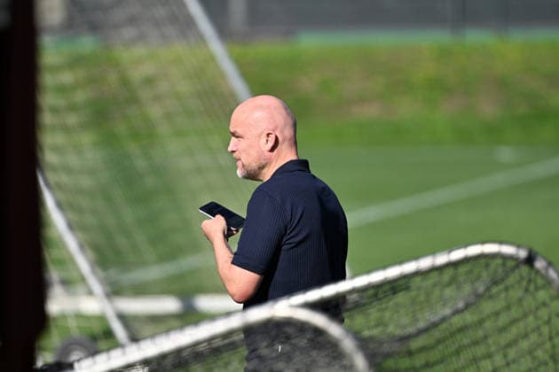 September 15, 2026, Mönchengladbach Soccer, Men s, 2026–2027 season, Borussia Mönchengladbach training session: Rouven Schroeder, Head of Sports, standing at the edge of the training field with his cell phone. DFL regulations prohibit the use of photographs as image sequences and or quasi-video footage at Borussia Park, North Rhine-Westphalia, Germany.