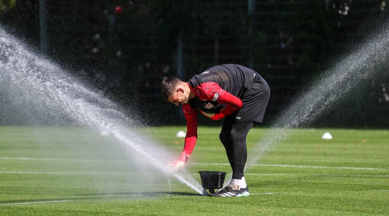 September 15, 2026, Germany, Stuttgart, VfB Stuttgart soccer practice, Fabian Bredlow wets his goalkeeper gloves