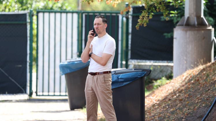 September 15, 2026, xrekx, Soccer, 2. Bundesliga, 1. FC Kaiserslautern Training: Marcel Klos, Sports Director of 1. FC Kaiserslautern, on his cell phone, smartphone, or phone in Kaiserslautern