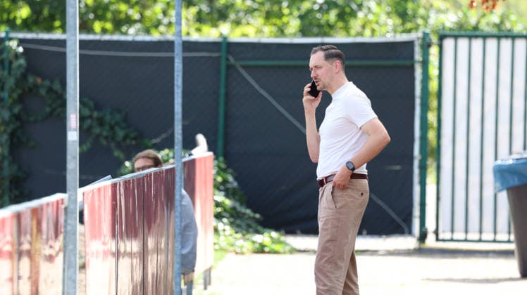 September 15, 2026, xrekx, Soccer, 2. Bundesliga, 1. FC Kaiserslautern Training: Marcel Klos, Sports Director of 1. FC Kaiserslautern, on his cell phone, smartphone, or phone in Kaiserslautern