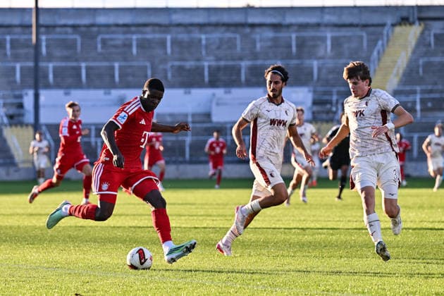 Bavarian Regional League: FC Bayern Munich II vs. FC Augsburg II, September 15, 2026, MUNICH, GERMANY September 15 in the match between Bastian ASSOMO (FC Bayern Munich II, No. 9) and Nick RASOULINA (FC Augsburg II, No. 21) and Till Sebastian SCHUMACHER (FC Augsburg II, No. 33) during the Bavarian Regional League match between the FC Bayern amateurs and FC Augsburg II on Matchday 9 at Grünwalder Stadium Copyright: xBEAUTIFULxSPORTS Goldbergx