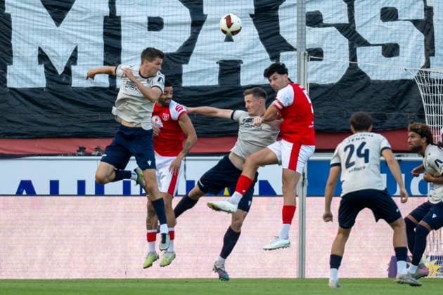 Regionalliga Northeast, Season 26-27: Hallescher FC vs. FC Carl Zeiss Jena, Halle, Germany, September 15, 2026. Pictured, from left: Luca Wollschlaeger (Jena), Stanley Ratifo (Halle), Timon Burmeister (Jena), and Burim Halili (Halle). Halle-Saale Leuna Chemie Stadium, Saxony-Anhalt, Germany