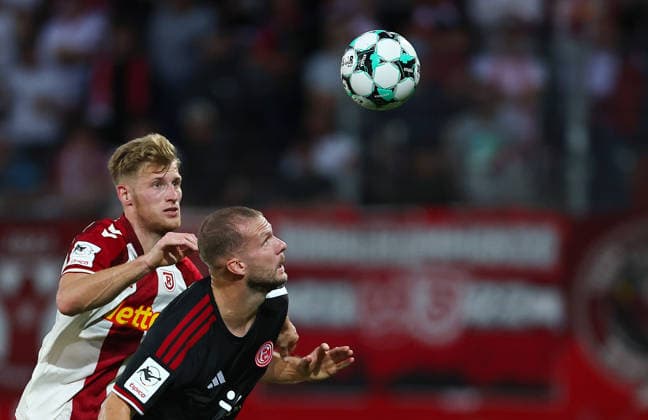 Football german 3. Liga Jahn Regensburg vs Fortuna Dusseldorf Karbstein Malte of Regensburg ( L ) and Hottmann Eric of Fortuna Dusseldorf ( R ) fight for the ball during the 3. Liga football match between Jahn Regensburg and Fortuna Dusseldorf at Jahn Stadium in Regensburg , Bayern , Germany . September 15th , 2026 Copyright: xDavidexEliasx