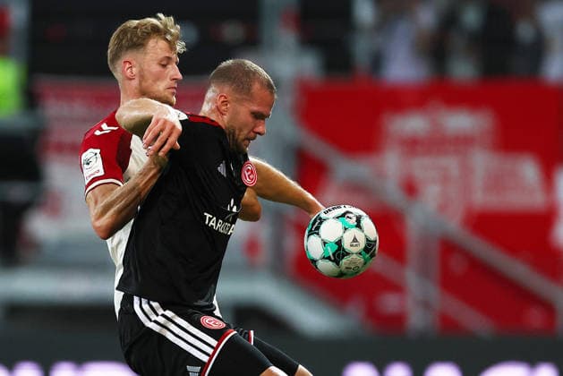 Football german 3. Liga Jahn Regensburg vs Fortuna Dusseldorf Karbstein Malte of Regensburg ( L ) and Hottmann Eric of Fortuna Dusseldorf ( R ) fight for the ball during the 3. Liga football match between Jahn Regensburg and Fortuna Dusseldorf at Jahn Stadium in Regensburg , Bayern , Germany . September 15th , 2026 Copyright: xDavidexEliasx