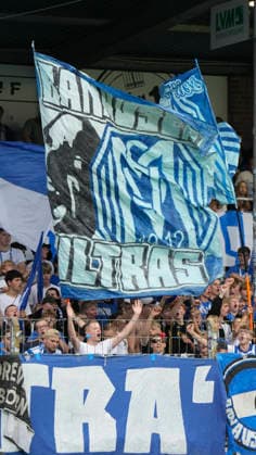 September 15, 2026, Hänsch Arena, Meppen, GER, 3rd Division, Matchday 6: SV Meppen vs. Viktoria Köln, SVM fans with an Ultras flag. DFL REGULATIONS PROHIBIT ANY USE OF PHOTOGRAPHS AS IMAGE SEQUENCES AND OR QUASI-VIDEO. Meppen, Lower Saxony, Hänsch Arena