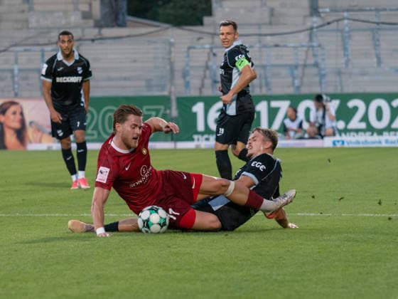 Tackle between Tim Rossmann (SG Sonnenhof Grossaspach, 11) and Nick Seidel (SC Verl, 05); both on the ground; grass field, Germany; soccer; SG Sonnenhof Grossaspach vs. SC Verl, 3rd Division, Matchday 6, Aspach, 2026–2027 season, September 15, 2026, GER, soccer, SG Sonnenhof Grossaspach vs. SC Verl, 3rd Division, Matchday 6, 2026–2027 season, September 15, 2026, Aspach Copyright: xCarstenxSchweringx EP_CSG