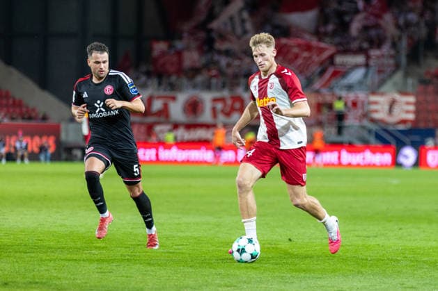 September 15, 2026, Soccer, GER, Season, 3rd Division, 2026–2027 Season, Matchday 6, SSV Jahn Regensburg vs. Fortuna Düsseldorf: Malte Karbstein of SSV Jahn Regensburg in action against Yassine Bouchama of Düsseldorf. DFL regulations prohibit any use of photographs as image sequences and or quasi-video.