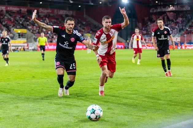 September 15, 2026, Soccer, GER, Season, 3. Liga, 2026–2027 Season, Matchday 6, SSV Jahn Regensburg vs. Fortuna Düsseldorf, Matthias Zimmermann (Düsseldorf) and Oscar Schönfelder (SSV Jahn Regensburg). DFL regulations prohibit any use of photographs as image sequences and or quasi-video.