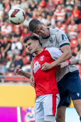 Regionalliga Northeast, Season 26-27: Hallescher FC vs. FC Carl Zeiss Jena, Halle, Germany, September 15, 2026. Pictured, from left, in a tackle: Fabrice Hartmann (Halle) and Moritz Fritz (Jena). Header, header duel. Halle, Saale-Leuna Chemie Stadium, Saxony-Anhalt, Germany
