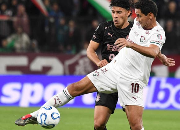 15th September 2026; Estadio Excelsior, Puerto Cortes, Honduras; CONMEBOL Libertadores Football, Platense versus Fluminense; Pablo Ferreira of Platense battles for possession with Paulo Henrique Ganso of Fluminense